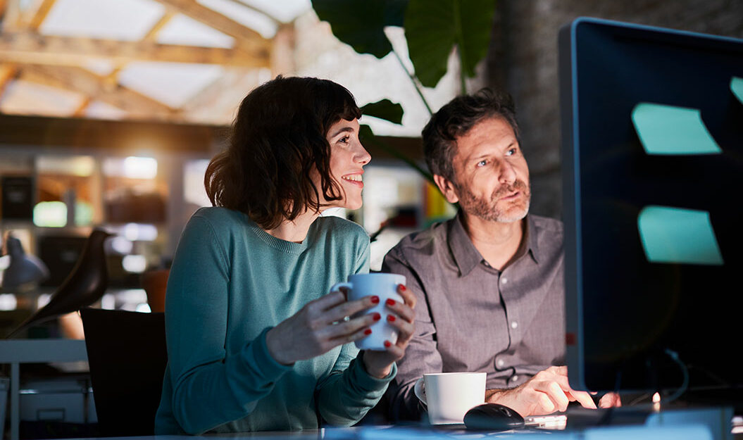 woman-and-man-at-desktop-1055x625